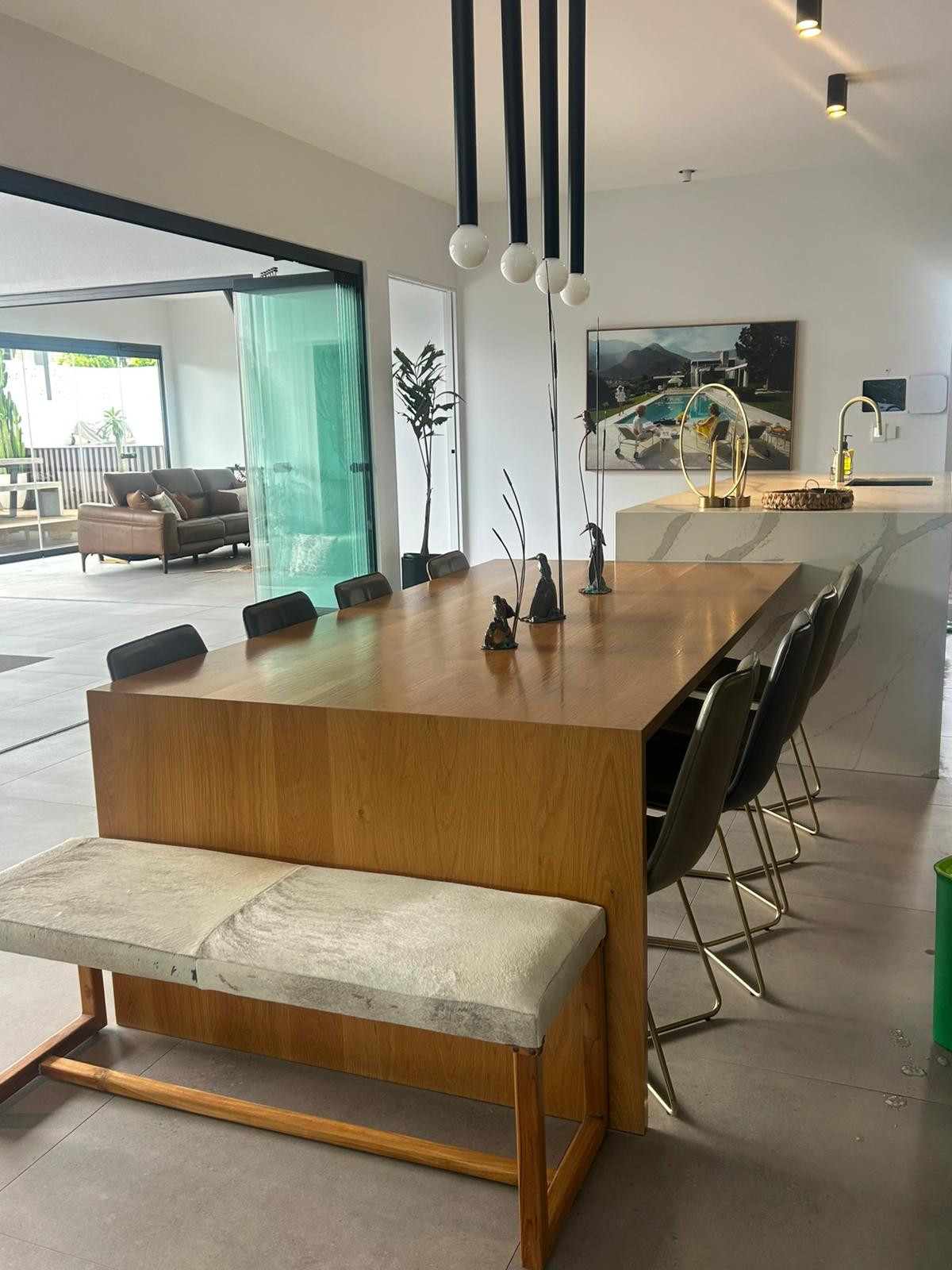 Outdoor tiles mid pressure-wash, visible clean versus dirty contrast